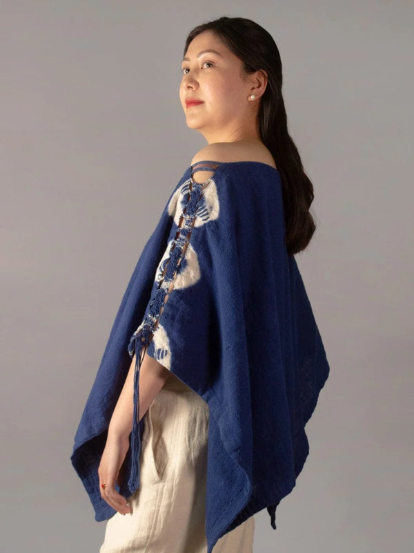 Wanderlust Indigo Poncho Handmade Handspun & Handwoven Kala Cotton with a macrame panel running through the garment, this piece is dip tie & dyed in Azo-free Indigo The Humane Collective