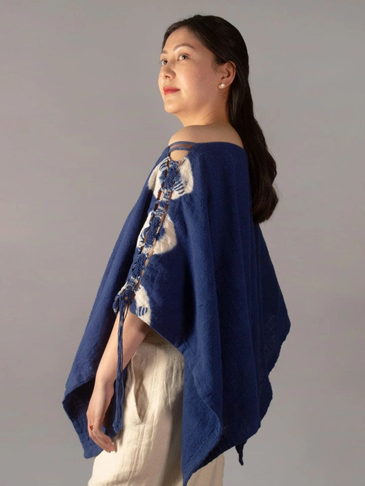 Wanderlust Indigo Poncho Handmade Handspun & Handwoven Kala Cotton with a macrame panel running through the garment, this piece is dip tie & dyed in Azo-free Indigo The Humane Collective