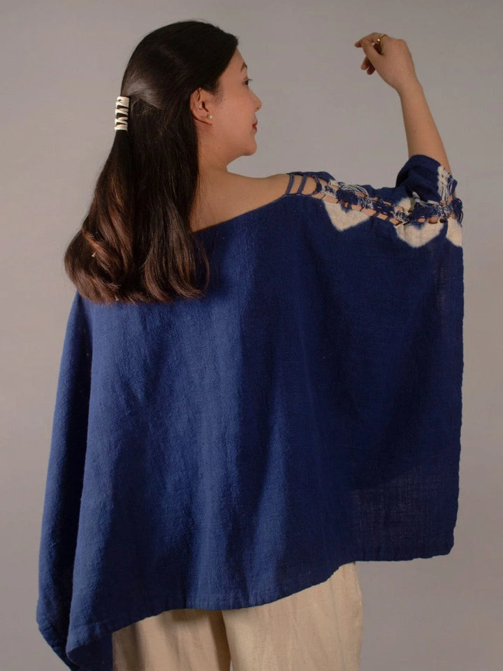 Wanderlust Indigo Poncho Handmade Handspun & Handwoven Kala Cotton with a macrame panel running through the garment, this piece is dip tie & dyed in Azo-free Indigo The Humane Collective